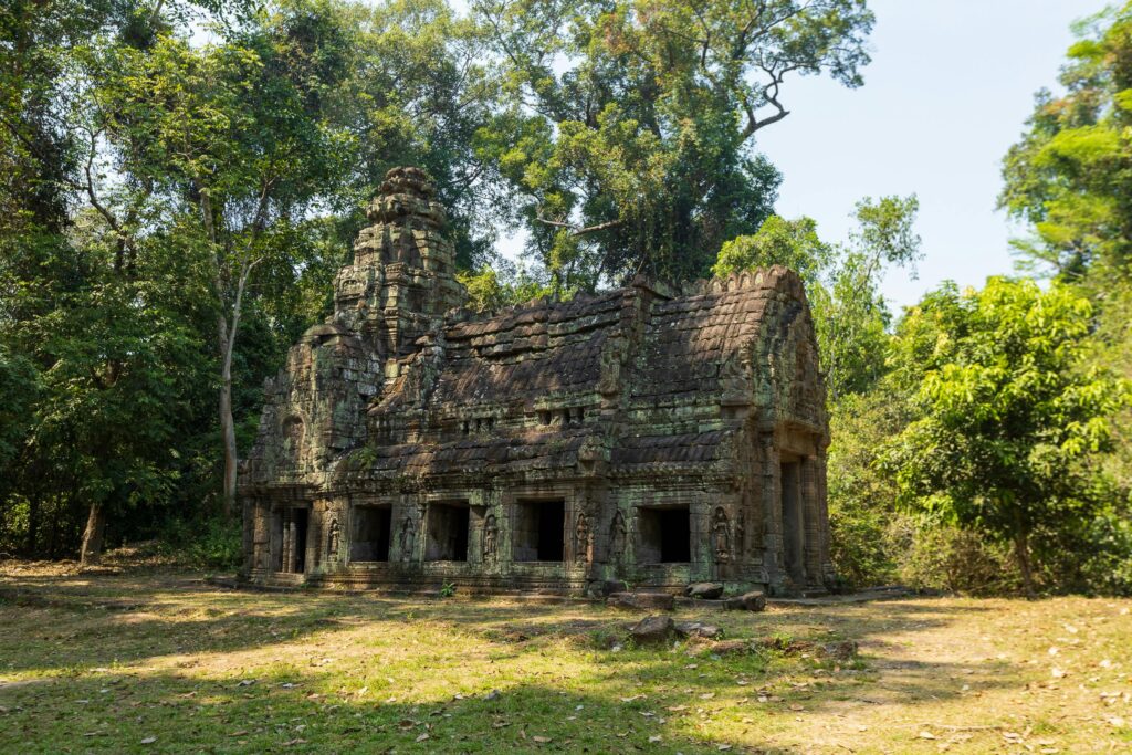 Explore the captivating ancient Khmer temple ruins nestled in the Cambodian jungle.