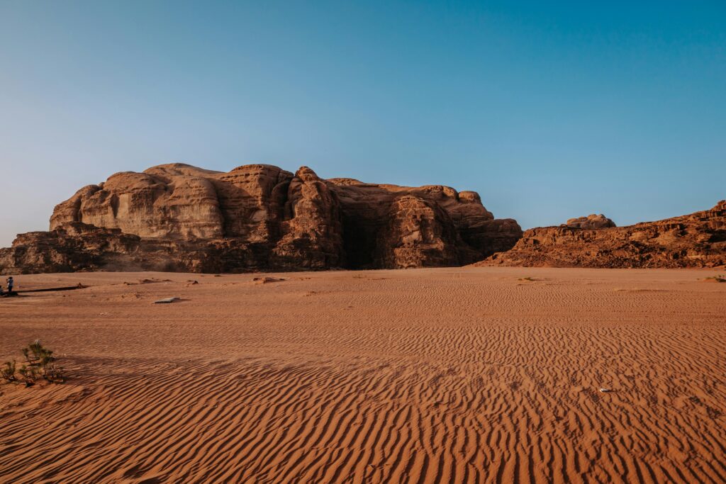 Explore the majestic sandstone formations in the desert landscapes of Wadi Rum, Jordan.