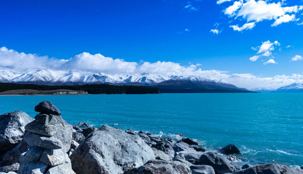 Breathtaking view of Lake Tekapo with Southern Alps and clear blue waters.