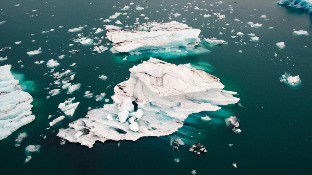 Stunning aerial photo of icebergs floating in the glacial waters of Iceland