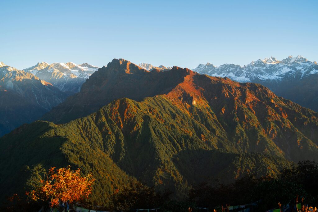 Capture the majestic view of the Himalayan mountains in Nepal during sunrise.