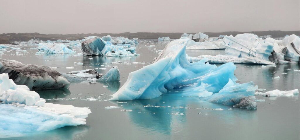 Icebergs floating in Jökulsárlón glacier lagoon, Iceland. Captivating and serene icy landscape.