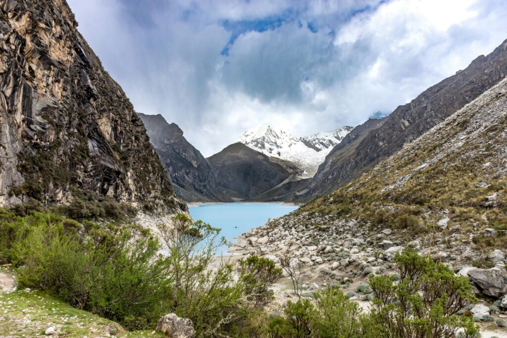 Breathtaking landscape of Llanganuco Lake surrounded by Andean mountains in Huaraz, Peru.